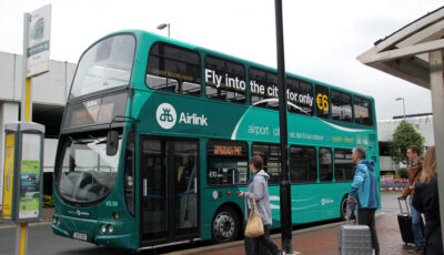An Airlink bus departs from the airport - Canadian Pacific - cc