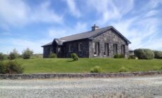 Detached cottage overlooking lake in Connemara